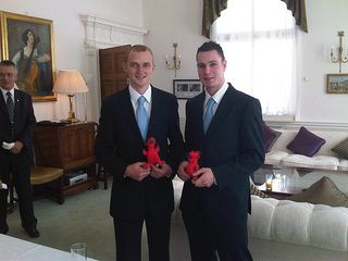 Cliff and Dean holding red dragon cuddly toys